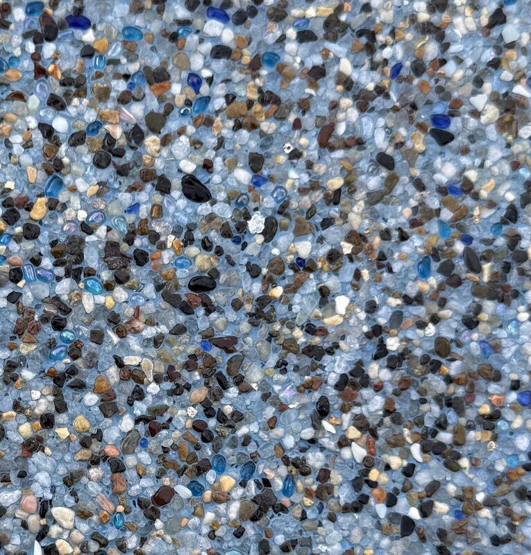 Mini pebble pool plaster close-up — natural river pebble aggregate finish by Phenomenal Pool & Landscape